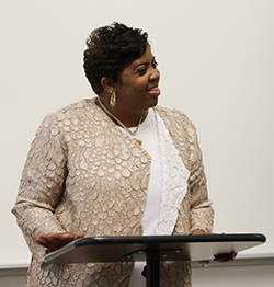 photo of Jackie Gill Powell speaking at an event
